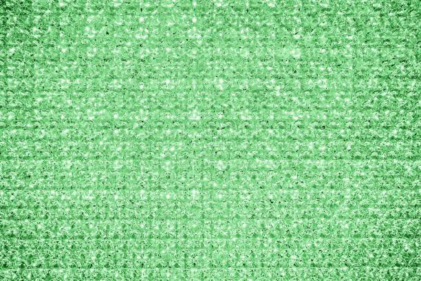 istock Green mint crystal glitter texture background. Glittery shiny lights 1225040639