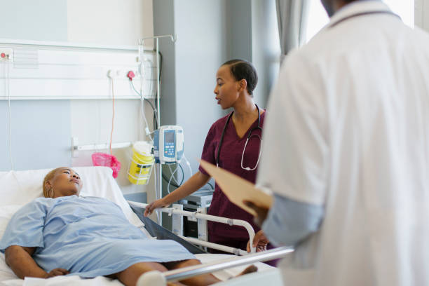 istock A Nurse checking on a Patient in a Hospital 1225041645