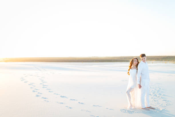 istock Newlyweds on a white desert island 1225041740