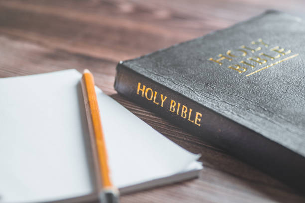 istock The Holy Bible with a pencil. Reading and learning the bible. 1225044744