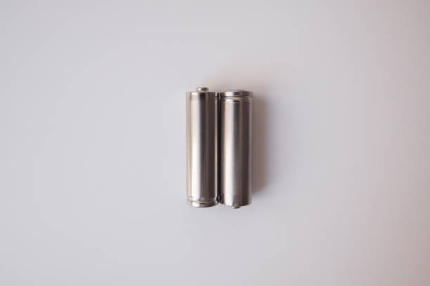 istock Two aa gray batteries on a white background 1225046813