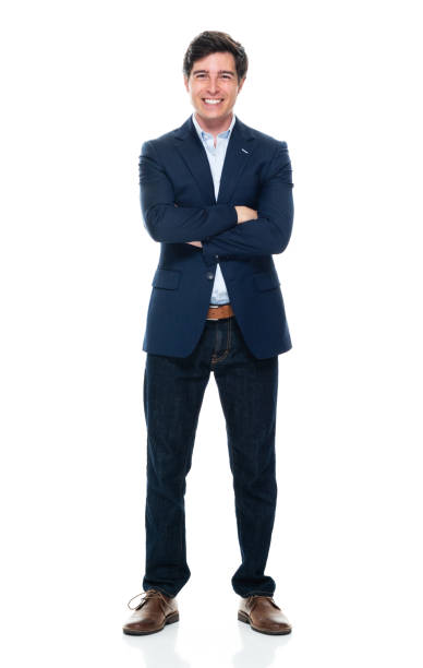 Caucasian young male business person standing in front of white background wearing jeans Full length of aged 20-29 years old with brown hair caucasian young male business person standing in front of white background wearing jeans who is successful with arms crossed blazer jacket stock pictures, royalty-free photos & images