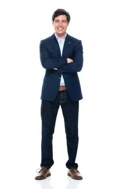 Photo of Caucasian young male business person standing in front of white background wearing jeans