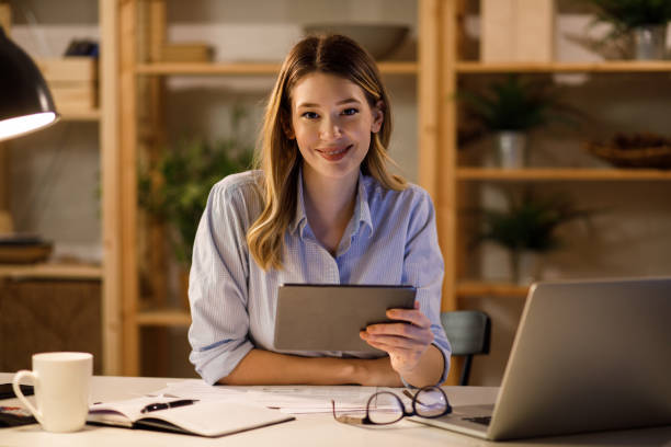istock Young woman working from home late at night 1225048970