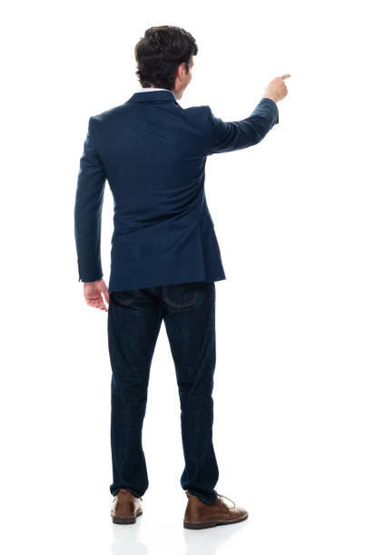 uomo d'affari maschio caucasico in piedi di fronte a uno sfondo bianco che indossa jeans - brown hair isolated on white short hair young men foto e immagini stock