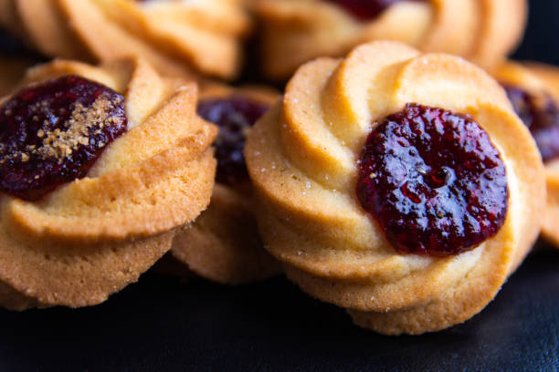istock Cookies with filling on a black background 1225050217