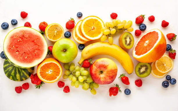 istock Assorted fresh fruits and berries on white background. 1225051456