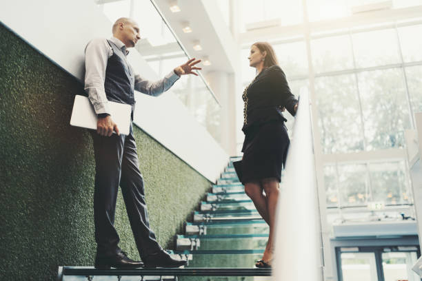 istock Business talk on office stair 1225052263