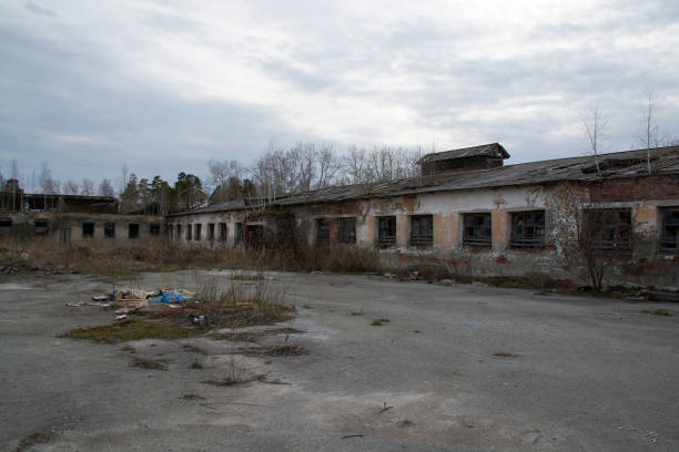 istock an old abandoned building with debris and broken Windows 1225053915