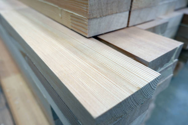 istock Glued pine timber beams for wooden windows closeup view, selective focus 1225054231
