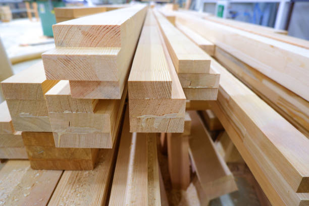 istock View from butt of stack of three-layer wooden glued laminated timber beams from pine finger joint spliced boards for wooden windows 1225055455