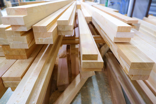 istock View from butt of stack of three-layer wooden glued laminated timber beams from pine finger joint spliced boards for wooden windows 1225055458