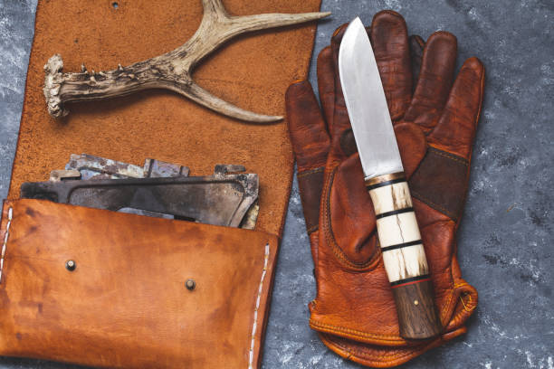 istock survival knife gloves and leather equipment 1225055759
