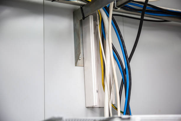 istock Cables on a white wall background, secured with ties. Horizontal orientation 1225055786