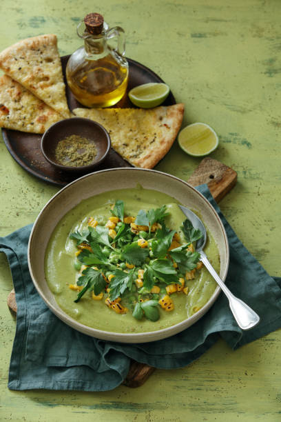 istock Spinach and Green Pea Soup with Grilled Corn 1225057300