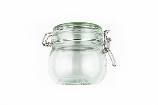 Closed glass jar with a metal latch, isolated on white background with clipping path.