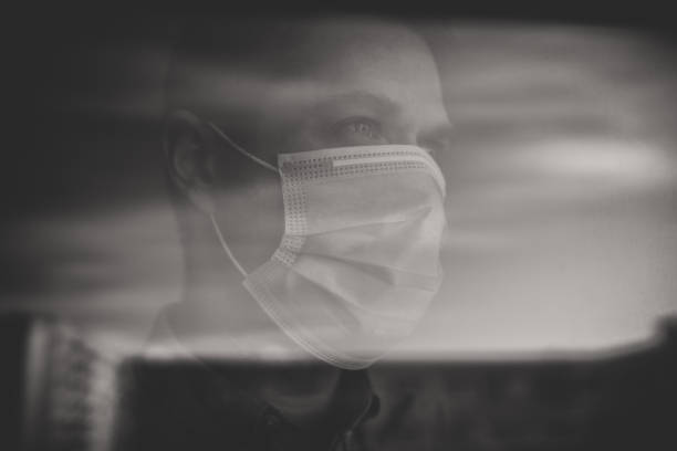 istock Man behind the window during self isolation. Stay home. 1225058602