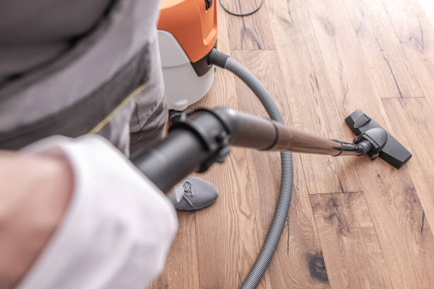 istock Male Worker Vacuuming Hardwood Flooring. 1225058743