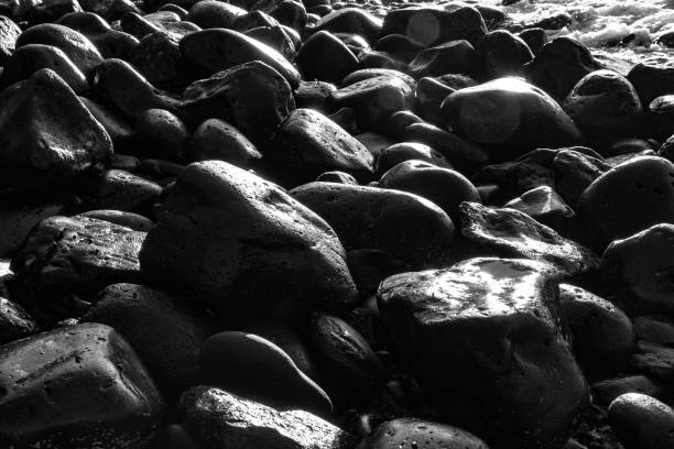 istock pebble stone beach in morning light 1225058800