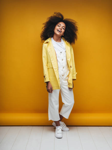 istock Young woman wearing raincoat 1225058857