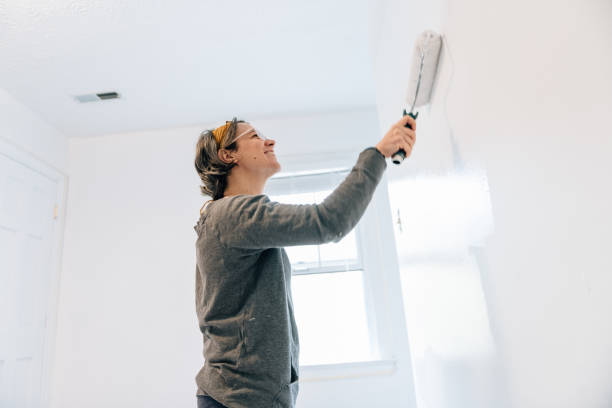 istock Woman painting a bedroom 1225058949