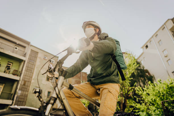 istock Delivery man riding a bike 1225061667