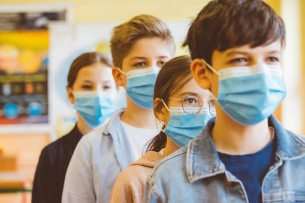 istock Group of student at a high school standing in line 1225062074