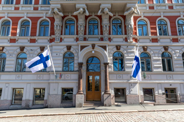 istock Historical building facade in Helsinki with Finnish flags flying 1225062770