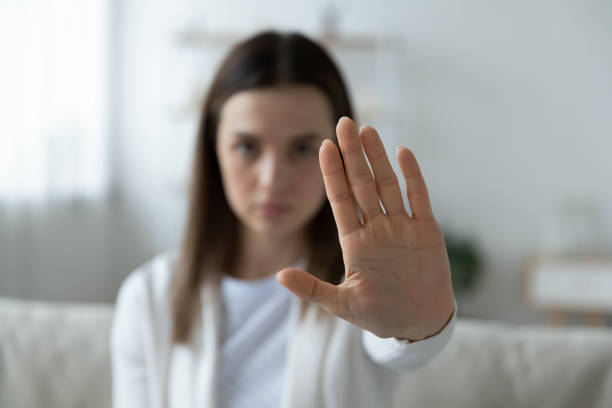 Young woman show stop gesture demonstrate protest