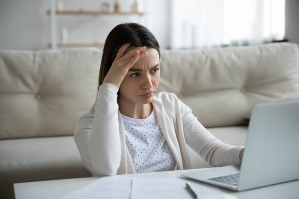 istock Unhappy woman stressed by slow internet connection on laptop 1225064172