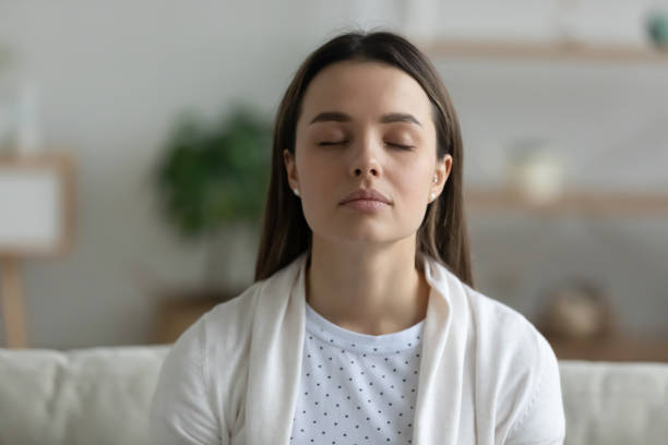 istock Millennial girl relax on couch at home dreaming 1225064177