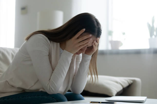 istock Upset young woman lost in thoughts having troubles 1225064240