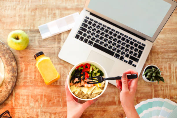 istock Crop freelancer eating healthy food 1225064241