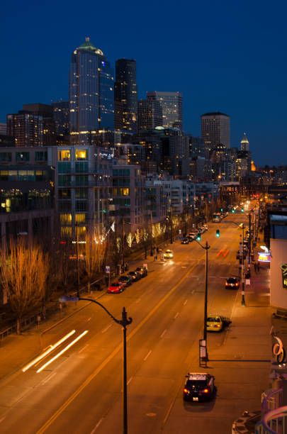 istock Seattle street at night with skyscrapers 1225064914