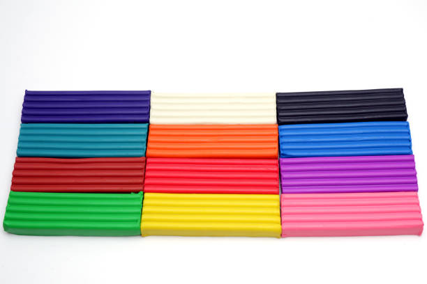 istock Bright multi-colored plasticine sticks on white background. Colorful plastic polymer clay set. 1225065498