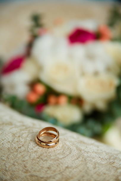 istock gold wedding rings close-up on a beige background 1225066342