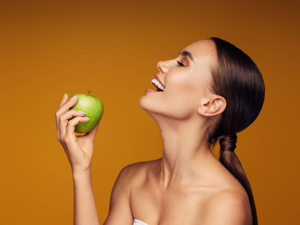 istock Beautiful girl with apple 1225066541