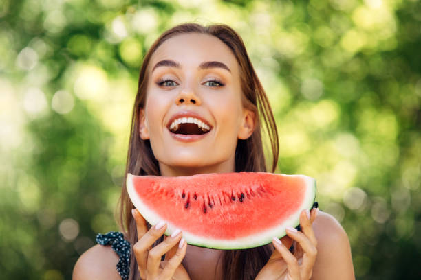 istock Enjoying sunny day wile eating watermelon 1225067411