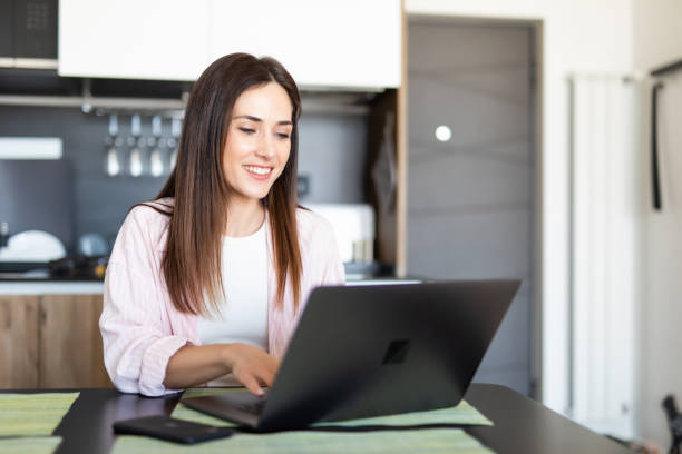 istock Female worker texting using laptop and internet, working online. Freelancer typing at home office, workplace. 1225067634