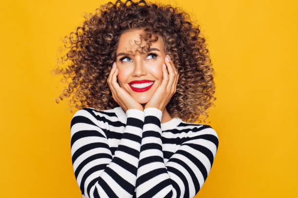istock Funky young girl against yellow background 1225068720