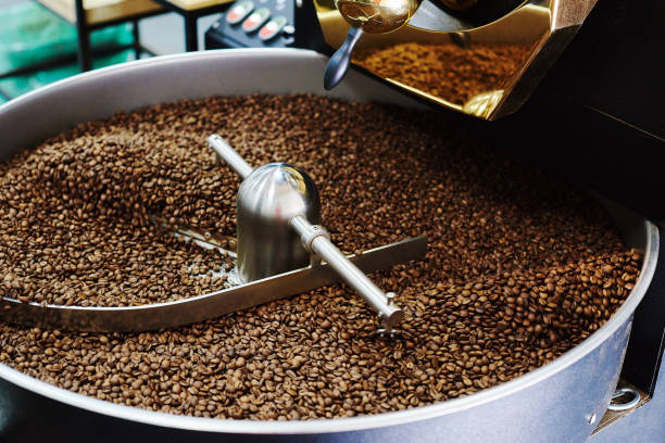 istock Coffee brown roasted beans. The roasting process in the roaster 1225069536
