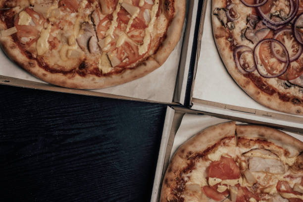 istock pizza in the in delivery box 1225072226