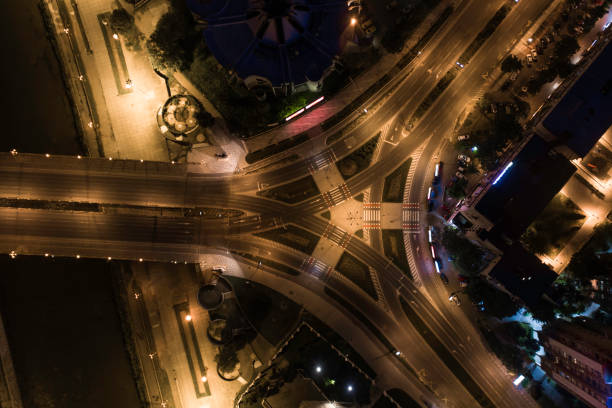 istock Night aerial top down view of a three way intersection 1225074514