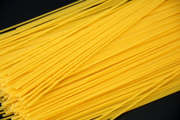 istock Spaghetti on dark gray background close up 1225076707