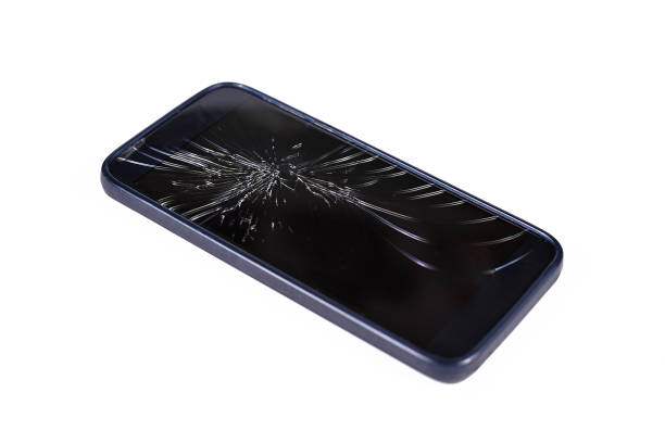 Broken shattered display of black smart phone isolated on white background