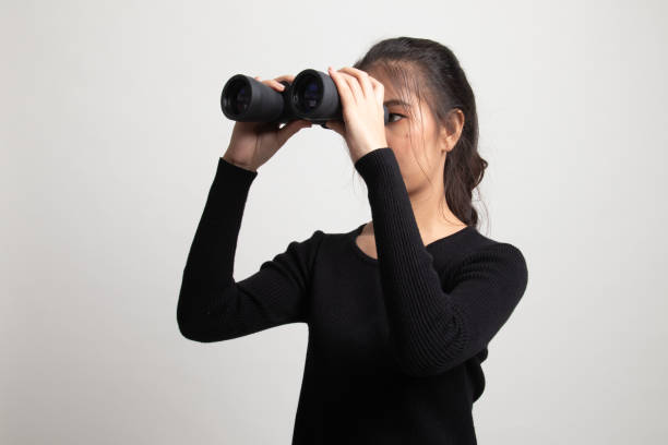 istock Young Asian woman with binoculars. 1225084164