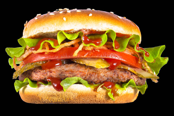 istock burger, white bun, with beef cutlet, lettuce, fried onions, tomato slice, cheese, new top, isolated on black background 1225085497