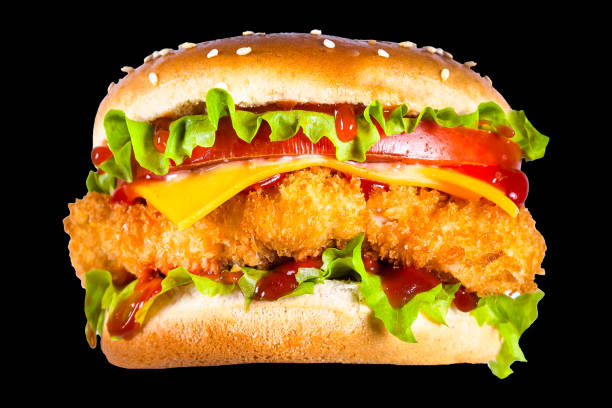 istock burger, white bun, with a big chicken cutlet, lettuce, cheese, new top, isolated on a black background 1225085500