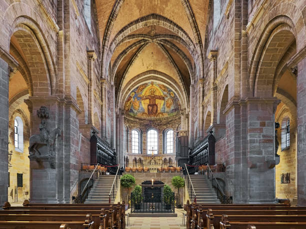 Interior of Bamberg Cathedral, Germany Bamberg, Germany - December 15, 2018: Eastern choir of Bamberg Cathedral. The Cathedral Church of St. Peter and St. George was founded in 1002. The current late Romanesque building was built in the 13th century. The Bamberg Horseman, an early 13th-century stone equestrian statue by an anonymous medieval sculptor, is visible on the pillar left of the choir. bamberg photos stock pictures, royalty-free photos & images