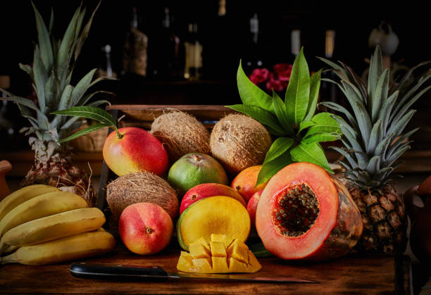 istock Wooden crates with assorted tropical fruits in rustic kitchen. Natural lighting 1225086892